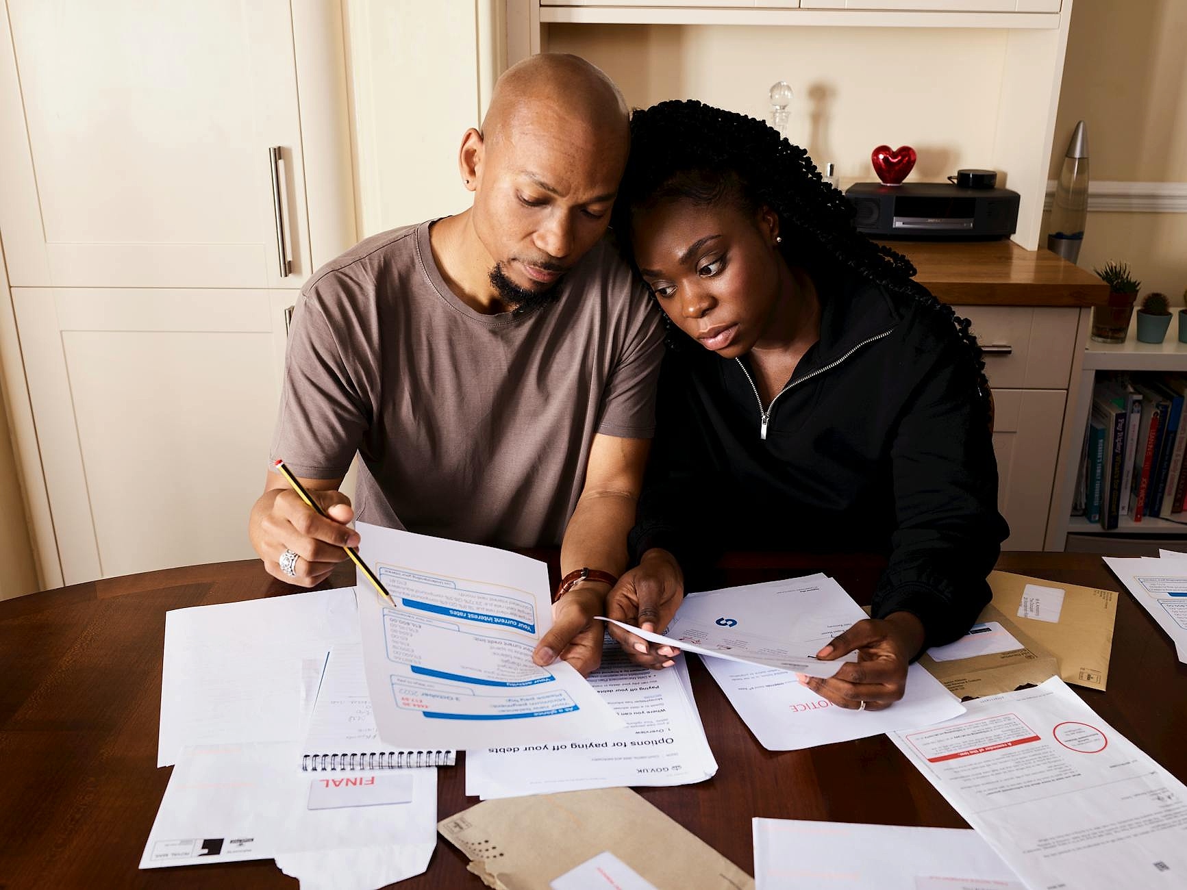 Household financial documents organized on a desk